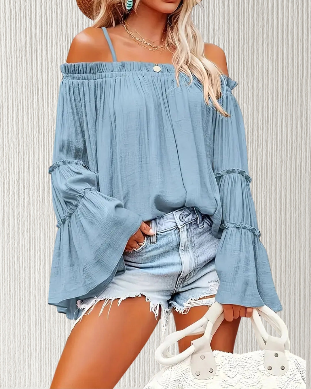 Aurora Off-the-Shoulder Ruffle Top – Blue; relaxed A-line fit with ruffle bell sleeves in lightweight polyester.