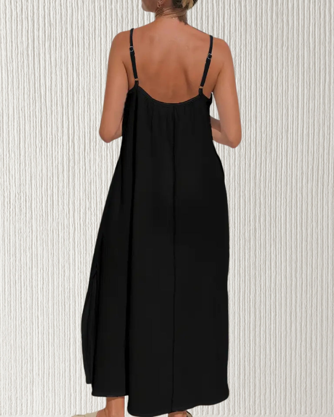 Isla Dress – Black, back view showing adjustable straps and ruched bust in breathable cotton muslin; relaxed, flattering silhouette for warm days