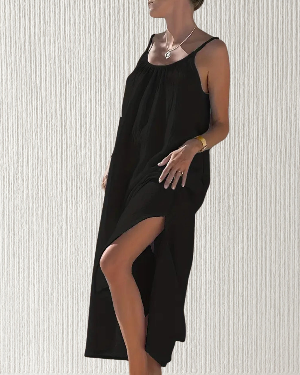Isla Dress – Black, women’s 100% cotton muslin midi dress with adjustable spaghetti straps, softly ruched bust, and elegant side splits for comfort and flow.
