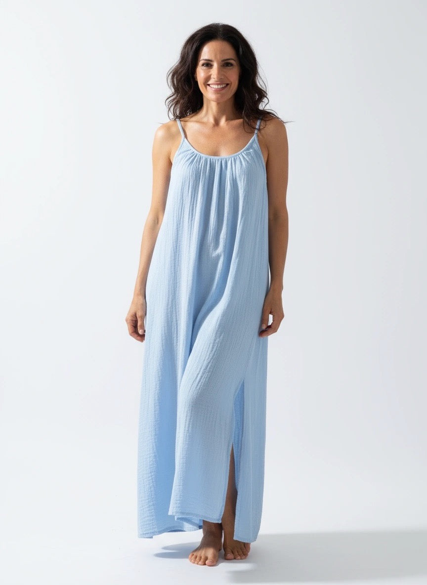 Isla Dress – Blue, women’s 100% cotton muslin midi dress with adjustable spaghetti straps, softly ruched bust, and elegant side splits for flow and comfort.