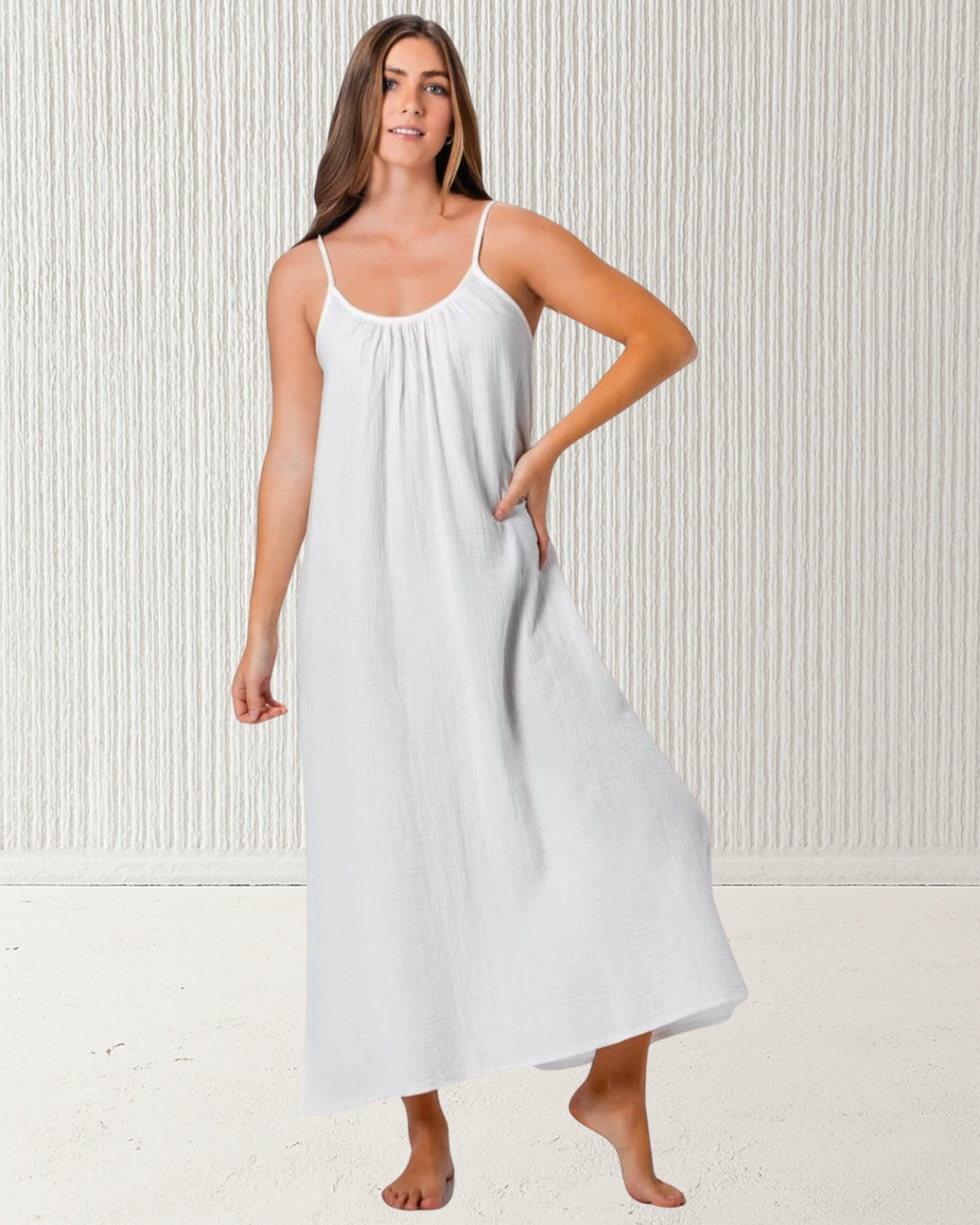 Isla Dress White – women’s 100% cotton muslin (cheesecloth) midi dress with spaghetti straps and relaxed fit. Lightweight, breathable summer style by Pastel & Earth.
