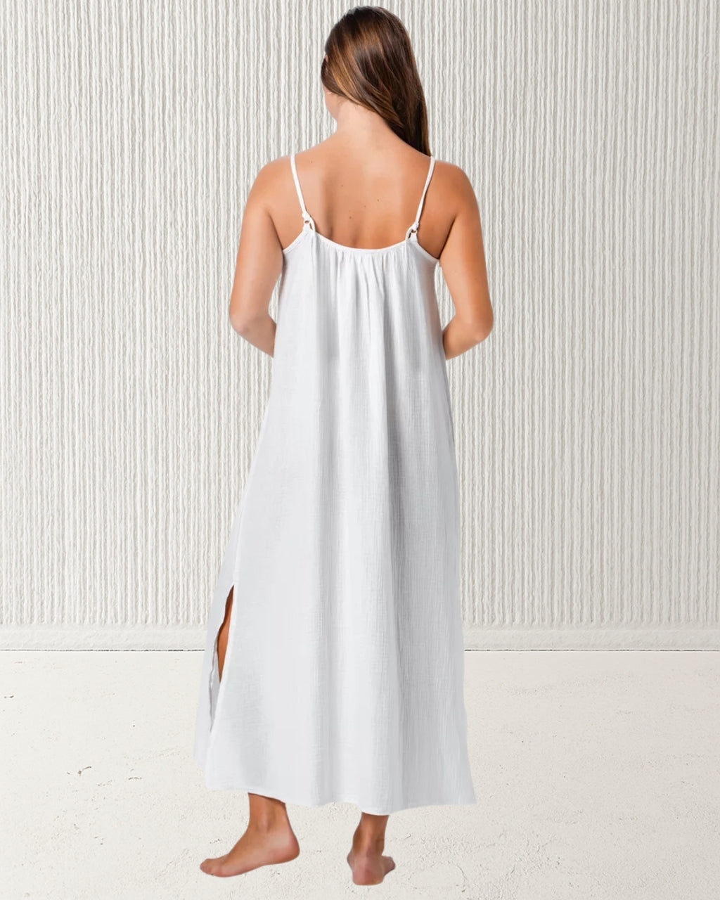 Isla Dress White – back view showing adjustable spaghetti straps and relaxed drape of 100% cotton muslin (cheesecloth) midi dress. Pastel & Earth summer style.