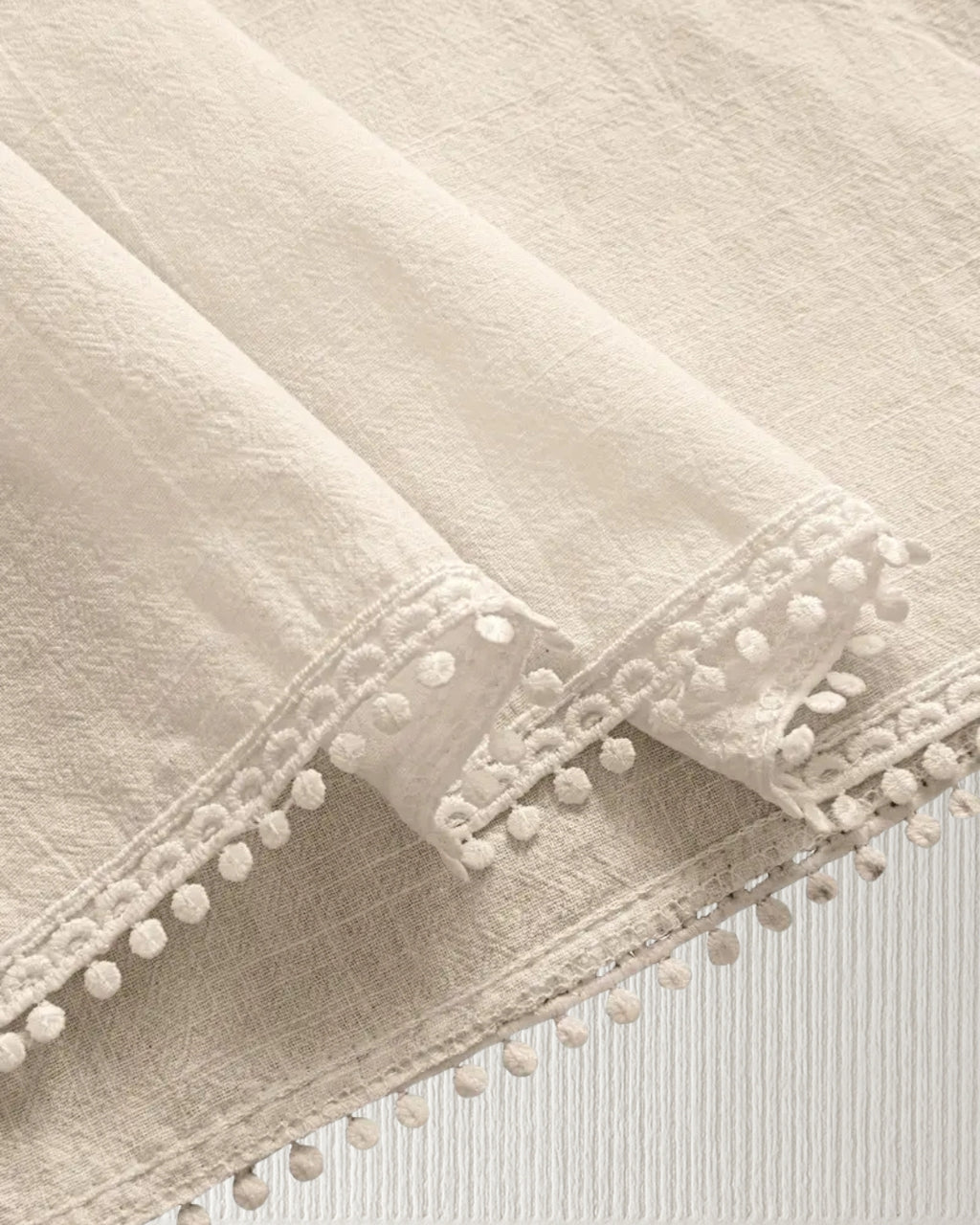 Aurora Camisole Top – Beige, hem trim close-up; lightweight cotton, airy drape.