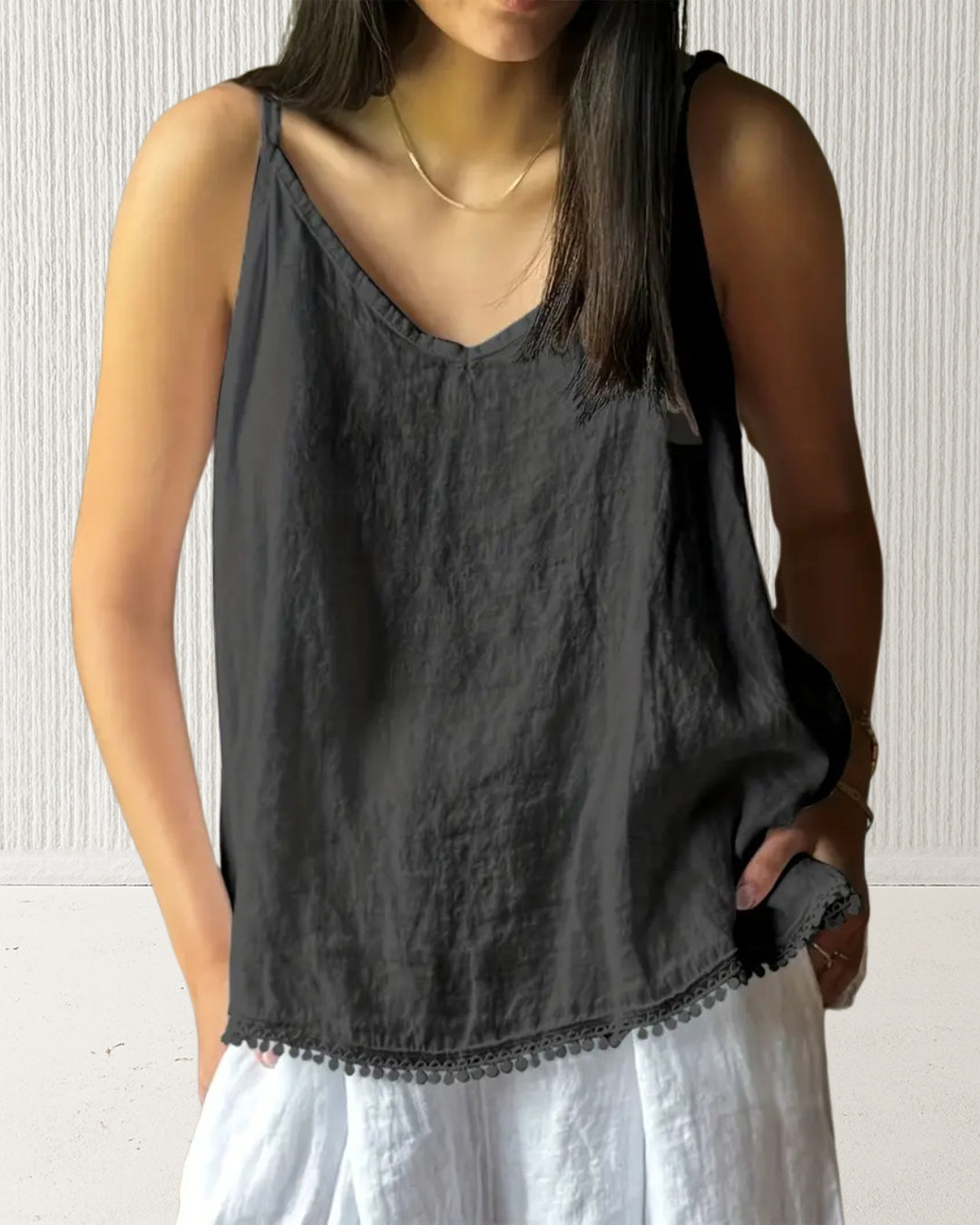 Aurora Camisole Top – Black on model; 100% cotton V-neck with adjustable straps and hem trim; relaxed, true-to-size.