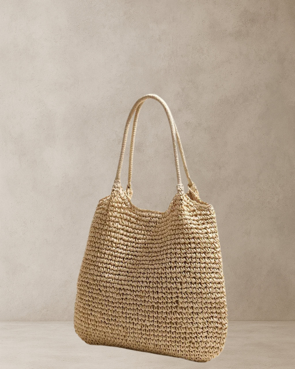 Coastal Raffia Tote Bag – Beige side view; raffia-style straw tote with soft handles and relaxed silhouette; everyday coastal bag.