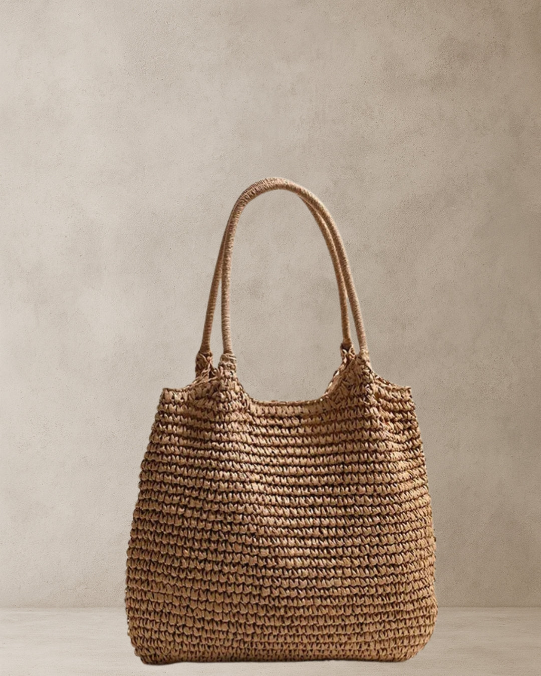 Coastal Raffia Tote Bag – Tan; woven straw tote bag with lined interior and magnetic clasp; lightweight everyday coastal carry.