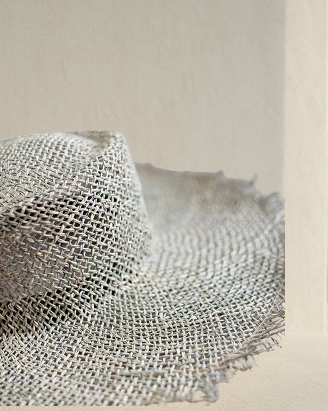Coastal Rattan Wide Brim Straw Hat brim detail; wide brim edge in natural rattan for sun coverage, lightweight coastal hat.