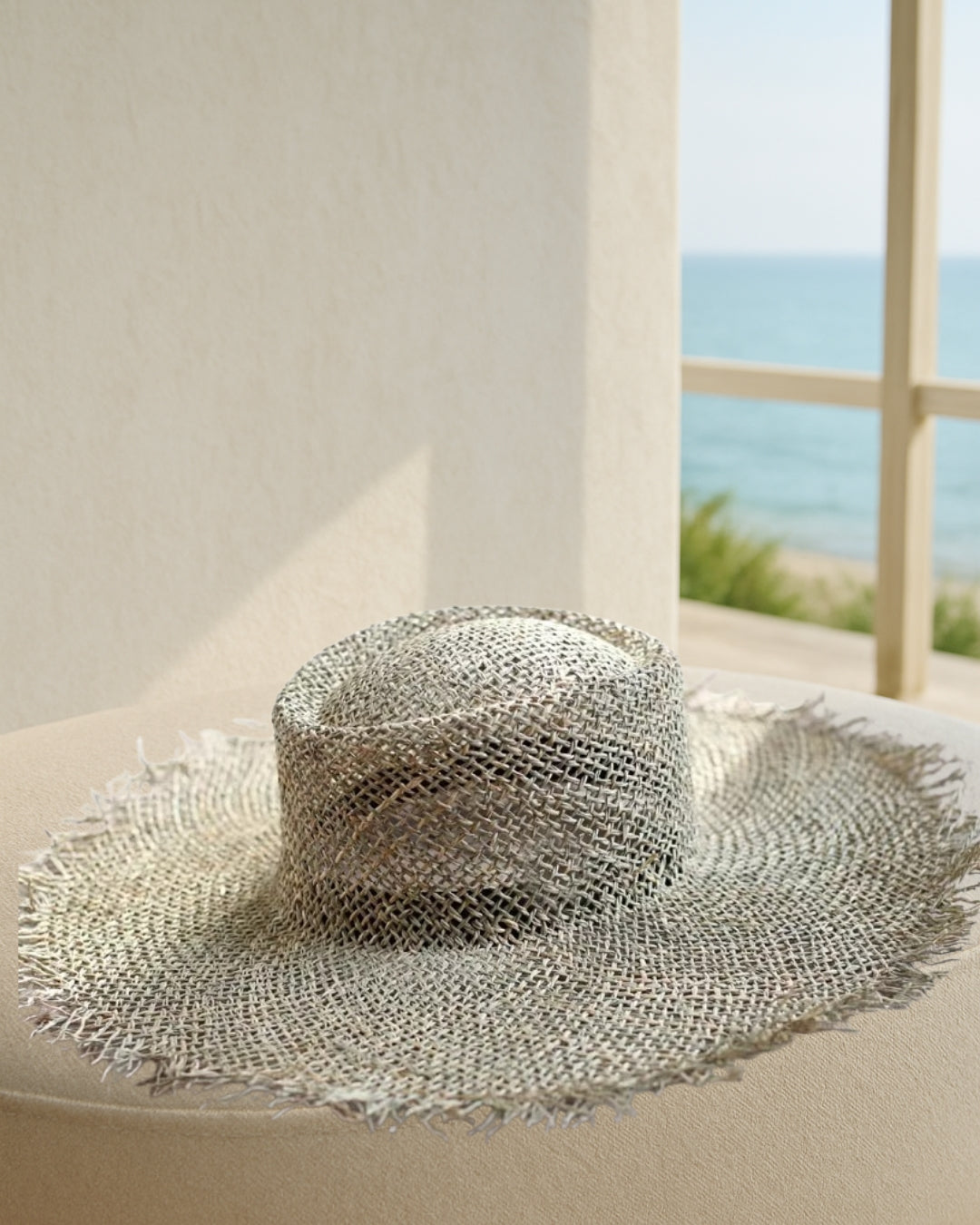 Coastal Rattan Wide Brim Straw Hat; front view of natural rattan sun hat, lightweight and breathable coastal style.