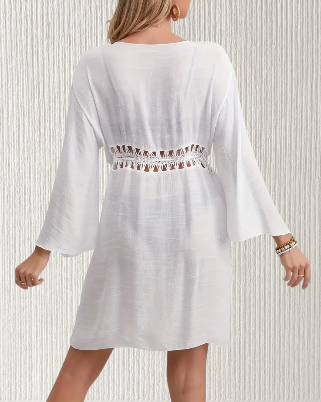 Willow Beach Cover-Up Dress – White; tassel tie waist, V-neckline, and flutter sleeves in semi-sheer, non-stretch polyester; perfect for beach to resort wear.